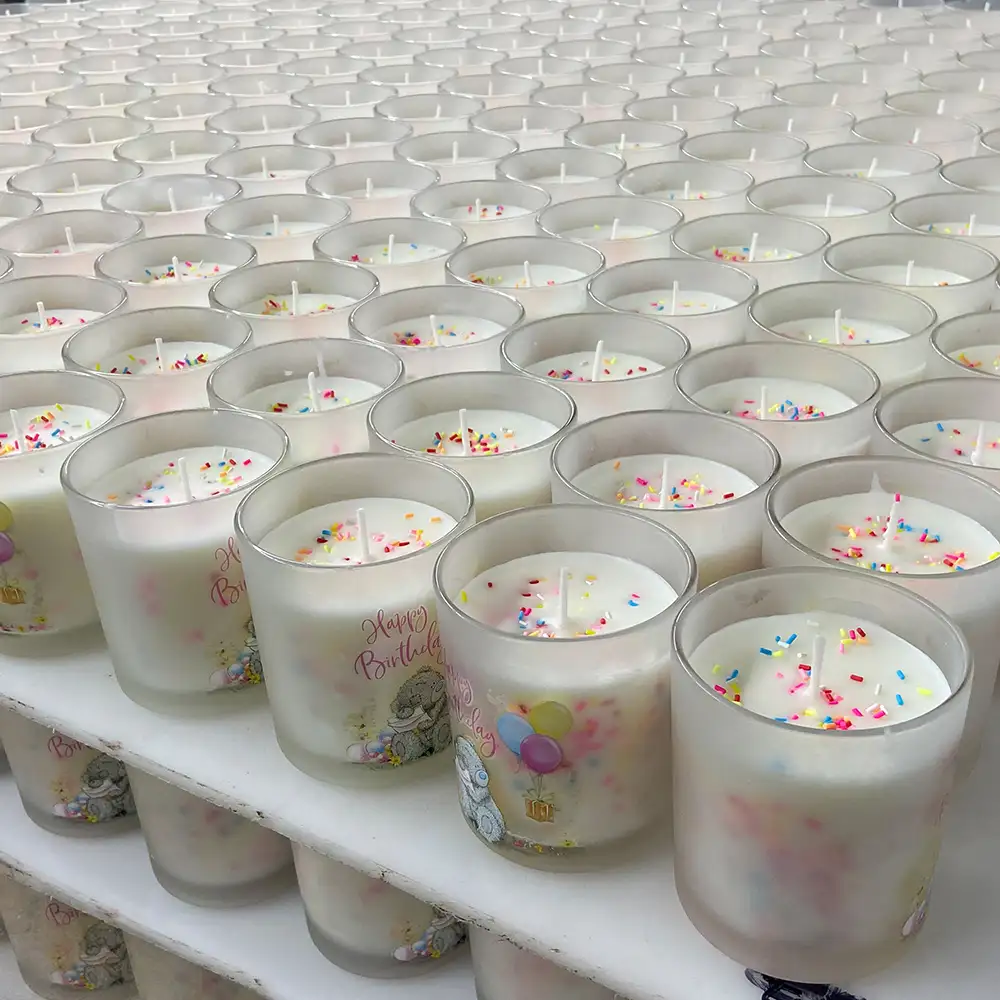 Place the scented candles on the shelf.