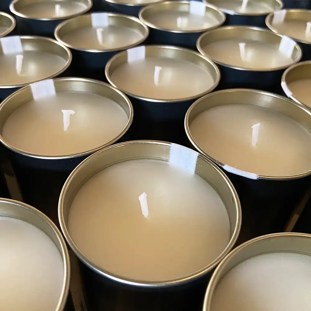 Finished private label scented candles in metal tins, bulk shipment for US wholesale customer